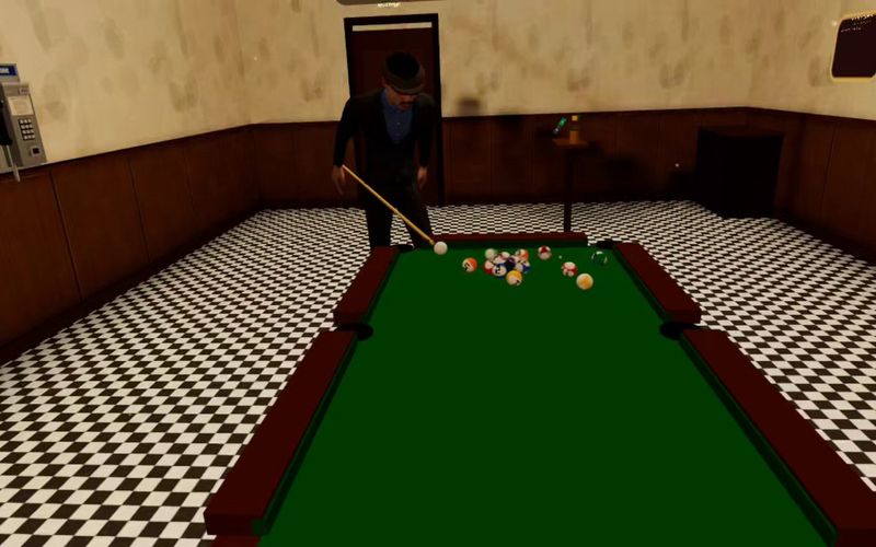 Joey lines up a shot at the pool table in the back room